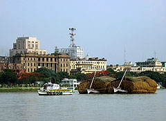 Boats going upstream on the Hooghly river in Kolkata.